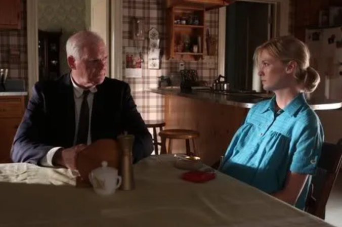 Mad Men - Betty Draper sitting at table with man