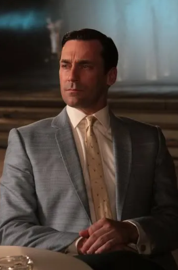 Mad Men - Don Draper in light grey suit and yellow tie